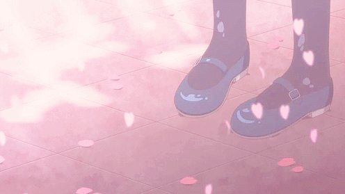 This may contain: a person standing on the ground with their feet up and wearing blue shoes in front of them