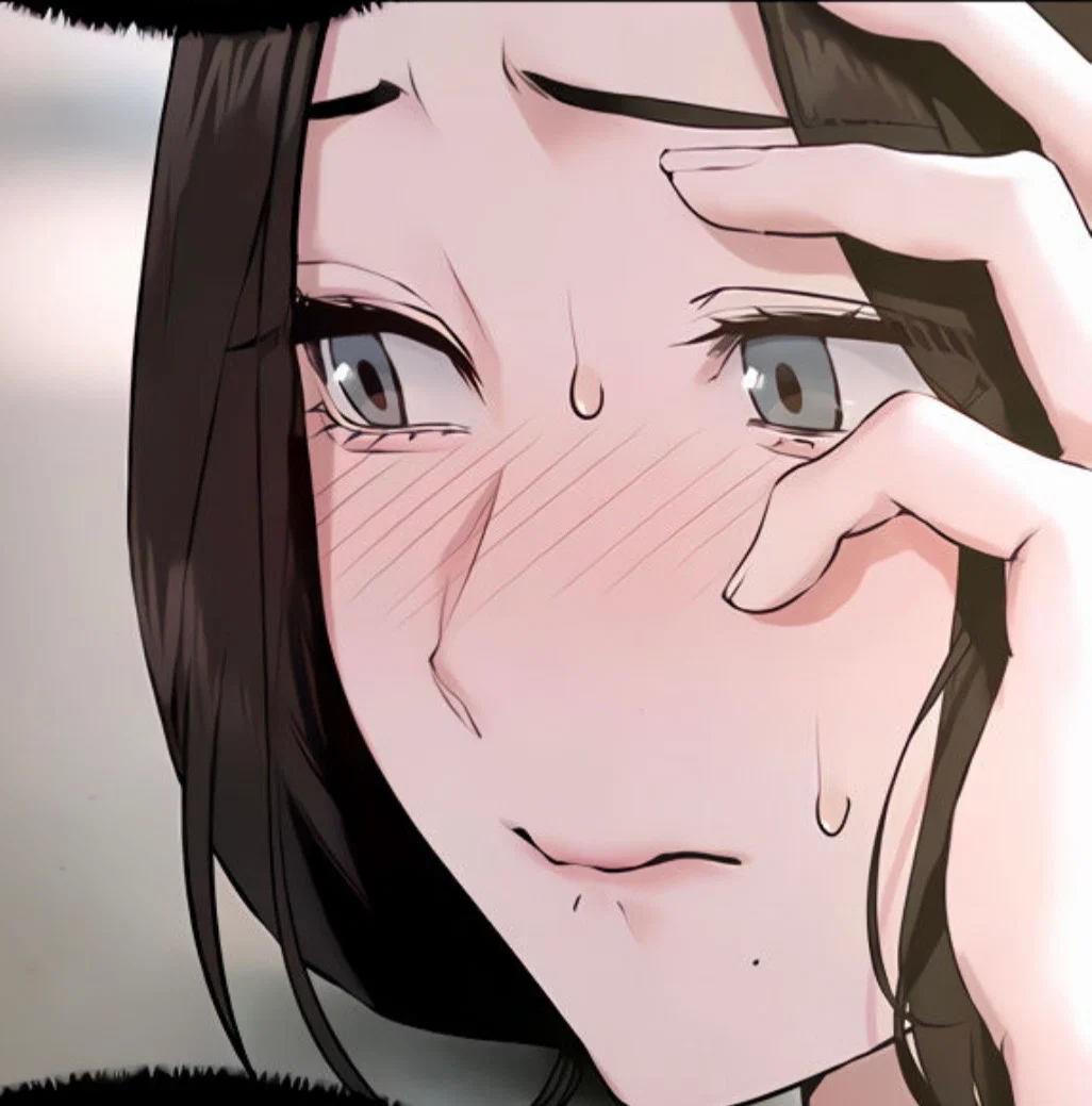 Han Yuri looks bashful, resting her palm against her cheek and looking away.