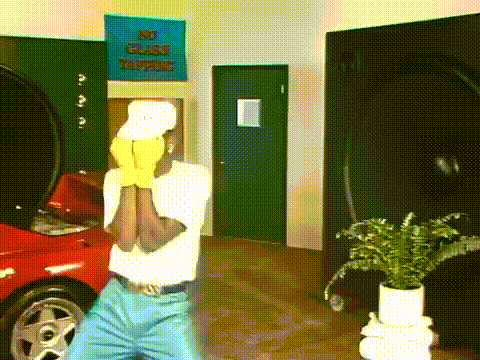 a man wearing a white hat and yellow gloves is standing in front of a sign that says no glass talking